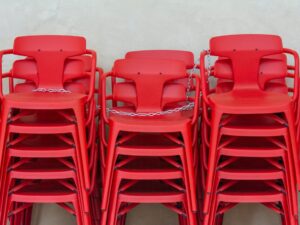 Stacks of Red Plastic Chairs