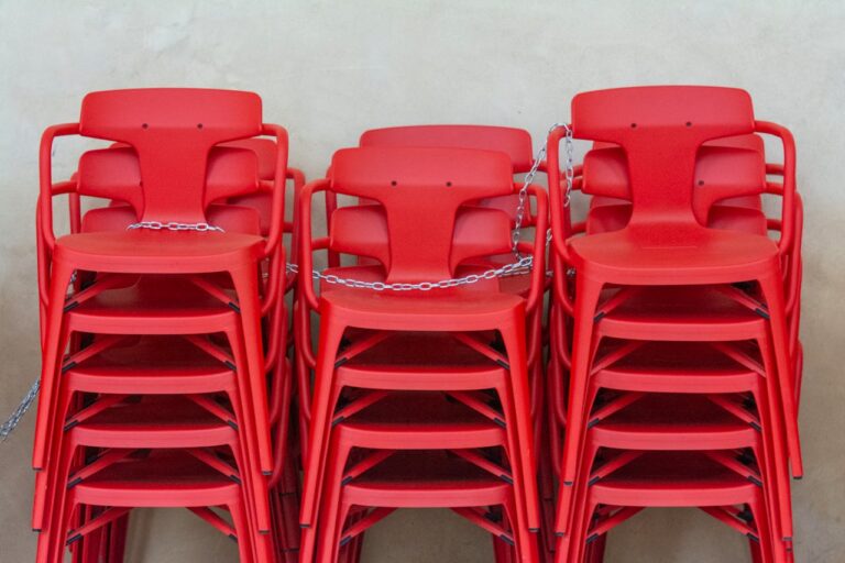 Stacks of Red Plastic Chairs