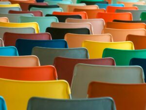 A colorful array of chairs in a classroom setting. Perfect for educational or design concepts.